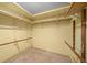 Large walk-in closet with wood shelving and hanging rods at 1981 Se 54Th Ter, Ocala, FL 34480