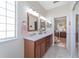 Modern bathroom with double sinks and a view into another room at 2111 Nw 58Th Ct, Ocala, FL 34482