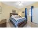 Well-lit bedroom with a comfortable bed and a ceiling fan at 2111 Nw 58Th Ct, Ocala, FL 34482