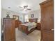 Spacious bedroom with wooden furniture and ceiling fan at 2111 Nw 58Th Ct, Ocala, FL 34482