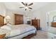 Spacious bedroom with wooden furniture and a ceiling fan at 2111 Nw 58Th Ct, Ocala, FL 34482