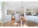 View of dining room from kitchen, showing a table for four and access to living room at 2111 Nw 58Th Ct, Ocala, FL 34482