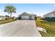 House exterior showcasing a two-car garage and curb appeal at 2111 Nw 58Th Ct, Ocala, FL 34482