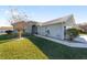 Landscaped front yard with a walkway to the entrance of the house at 2111 Nw 58Th Ct, Ocala, FL 34482