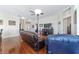 Living room with hardwood floors, leather furniture, and a fireplace at 2111 Nw 58Th Ct, Ocala, FL 34482