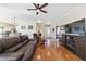 Living area with hardwood floors, leather furniture, and a view to the front entrance at 2111 Nw 58Th Ct, Ocala, FL 34482