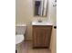 Updated bathroom with wood vanity and a modern toilet at 2317 Ne 37Th St, Ocala, FL 34479