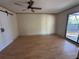 Spacious bedroom with ceiling fan and barn door at 2317 Ne 37Th St, Ocala, FL 34479