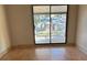 Bright bedroom with sliding glass doors leading to the backyard at 2317 Ne 37Th St, Ocala, FL 34479