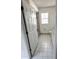 Bathroom with a shower/tub combo and white tile floors at 2849 Sw 140 Pl, Ocala, FL 34473