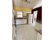 Kitchen area with white cabinets and tile flooring at 2849 Sw 140 Pl, Ocala, FL 34473