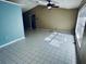 Spacious living room featuring tile flooring and a vaulted ceiling at 2849 Sw 140 Pl, Ocala, FL 34473