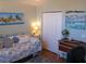 Bedroom with twin daybed, closet, and wood floors at 2969 Sw 142Nd Ln, Ocala, FL 34473