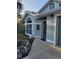 Light teal house with a walkway leading to the front door at 2969 Sw 142Nd Ln, Ocala, FL 34473