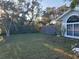 Landscaped yard with wooden fence and mature trees at 2969 Sw 142Nd Ln, Ocala, FL 34473