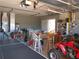 Organized garage with ping pong table, workbench, and ATV at 2969 Sw 142Nd Ln, Ocala, FL 34473