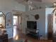 Spacious living room with hardwood floors and large TV at 2969 Sw 142Nd Ln, Ocala, FL 34473