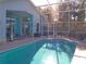 Relaxing screened-in pool area with patio furniture at 2969 Sw 142Nd Ln, Ocala, FL 34473