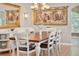 Bright dining area with hardwood floors and a rustic table at 3165 Hudson Ct, The Villages, FL 32162