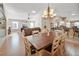 Bright dining room features a large wooden table with seating for six at 3165 Hudson Ct, The Villages, FL 32162