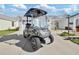 Golf cart parked in the driveway of a home at 3165 Hudson Ct, The Villages, FL 32162