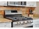 Stainless steel gas range and microwave in a well-lit kitchen at 3165 Hudson Ct, The Villages, FL 32162