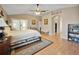 Large main bedroom with hardwood floors and en-suite bathroom at 3165 Hudson Ct, The Villages, FL 32162