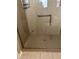 Walk-in shower with glass enclosure and built-in seat at 3165 Hudson Ct, The Villages, FL 32162