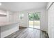 Bright dining area with sliding glass doors and wood-look floors at 4482 Sw Clearwater Ct, Dunnellon, FL 34431