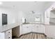 Modern kitchen with white cabinets and granite countertops at 4482 Sw Clearwater Ct, Dunnellon, FL 34431