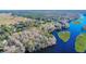 Aerial view of property showcasing waterfront access and nearby homes at 4925 Cr 309B, Lake Panasoffkee, FL 33538