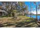 Spacious backyard with picnic table and water view at 4925 Cr 309B, Lake Panasoffkee, FL 33538