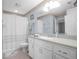 Bathroom with white cabinets and a shower/tub combo at 4925 Cr 309B, Lake Panasoffkee, FL 33538