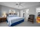 King-size bed, ensuite bathroom and leather chair in a Primary bedroom at 4925 Cr 309B, Lake Panasoffkee, FL 33538