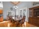 Bright dining room with hardwood floors and access to patio at 4925 Cr 309B, Lake Panasoffkee, FL 33538