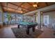 Game room with pool table and scenic lake view at 4925 Cr 309B, Lake Panasoffkee, FL 33538