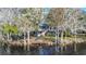 Waterfront home with expansive deck and lush landscaping at 4925 Cr 309B, Lake Panasoffkee, FL 33538