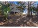 Landscaped yard with mature trees and privacy at 4925 Cr 309B, Lake Panasoffkee, FL 33538