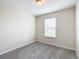 Simple bedroom with carpet and a window with blinds at 5 Walnut Ct, Ocala, FL 34480