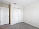 Spacious bedroom with double door closet and carpet flooring at 5 Walnut Ct, Ocala, FL 34480