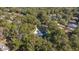 Aerial view showcasing home's location in a wooded neighborhood at 5224 Se 44Th Cir, Ocala, FL 34480