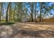 Large backyard with shed and circular gravel area at 5224 Se 44Th Cir, Ocala, FL 34480