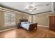 Spacious main bedroom with hardwood floors and large windows at 5224 Se 44Th Cir, Ocala, FL 34480