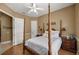 Bedroom with four-poster bed and wood floors at 5224 Se 44Th Cir, Ocala, FL 34480