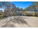 House exterior with three-car garage and circular driveway at 5224 Se 44Th Cir, Ocala, FL 34480