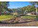 Side view of house exterior with mature trees and landscaping at 5224 Se 44Th Cir, Ocala, FL 34480