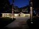 House exterior at night with landscape lighting at 5224 Se 44Th Cir, Ocala, FL 34480