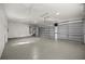 Large garage with double doors and epoxy flooring at 5224 Se 44Th Cir, Ocala, FL 34480