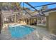 Large, refreshing pool with a spa, screened enclosure, and patio at 5224 Se 44Th Cir, Ocala, FL 34480