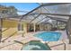 Spacious pool with a spa and screened enclosure at 5224 Se 44Th Cir, Ocala, FL 34480